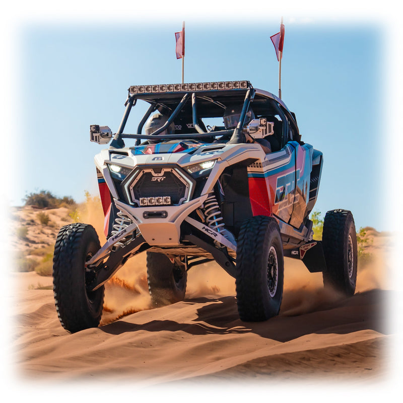 Load image into Gallery viewer, DRT Polaris RZR Pro R /Pro S/Turbo R 2022+ riding on sand with the V2.0 Front Winch Bumper on white