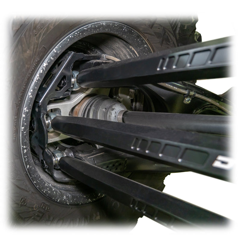 Load image into Gallery viewer, Installed barrel radius rod kit under rear control arm of Maverick X3 Wheel Close up