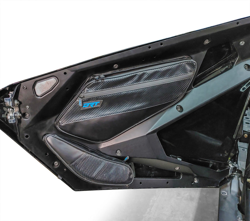 Load image into Gallery viewer, Close-up of front door storage pockets installed on RZR Pro XP