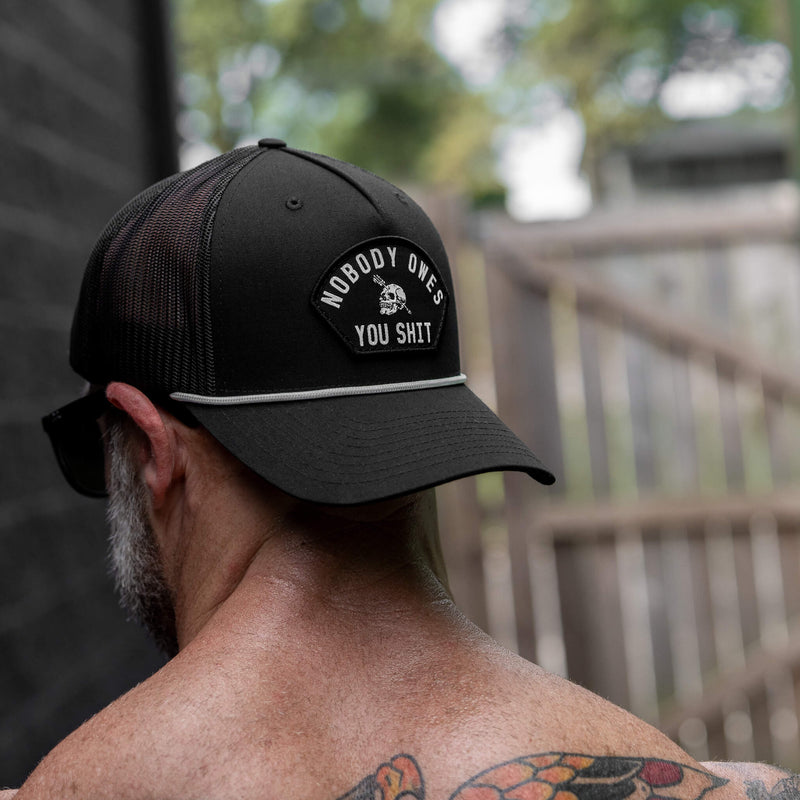 Load image into Gallery viewer, Nobody Owes You Shit Skull Arched Patch Rope Snapback