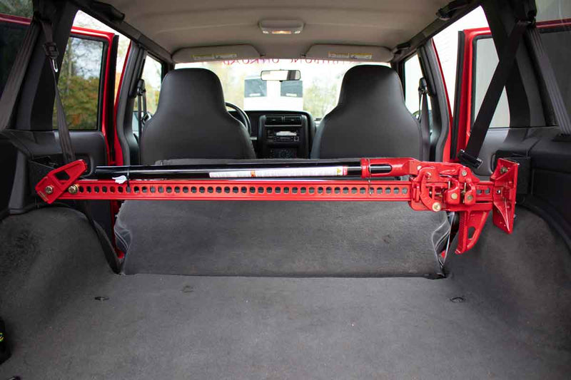 Load image into Gallery viewer, Fishbone Offroad Rear Seat Hi-Lift Jack Mount for 1984-2001 Jeep Cherokee FB25314