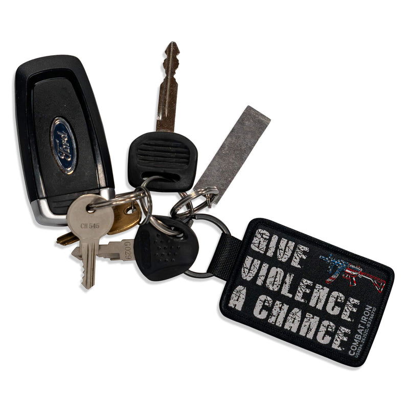 Load image into Gallery viewer, Give Violence A Chance Flight Tag Keychain
