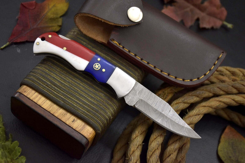 Load image into Gallery viewer, Handcrafted Damascus Steel Pocket Knife – Texas Flag Handle & Leather Sheath | Collectible EDC Gift