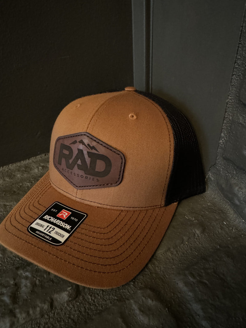 Load image into Gallery viewer, Rad Accessories Snap Back Leather Patch Trucker Hat Caramel & Black