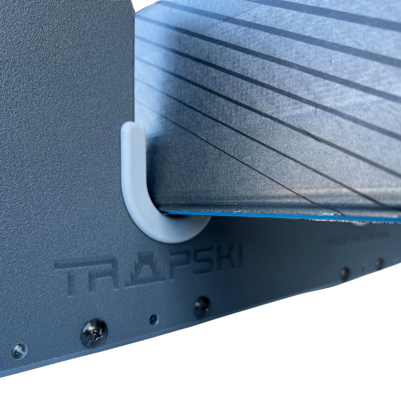 Load image into Gallery viewer, TRAPSKI LowPro 4 L Ski and Snowboard Rack Insert for Rooftop Cargo Box | High Quality Marine Grade HDPE Plastic | Premium Strap Included | 3 Year Warranty | Made in the USA | Veteran Owned Business