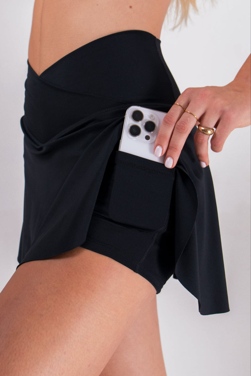 Load image into Gallery viewer, Women's Athletic Skort with Built-In Shorts & Pockets - Black | LuxeForm Criss-Cross Waist