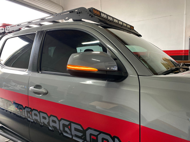 Load image into Gallery viewer, Toyota Tacoma Smoked Sequential Mirror Turn Signal