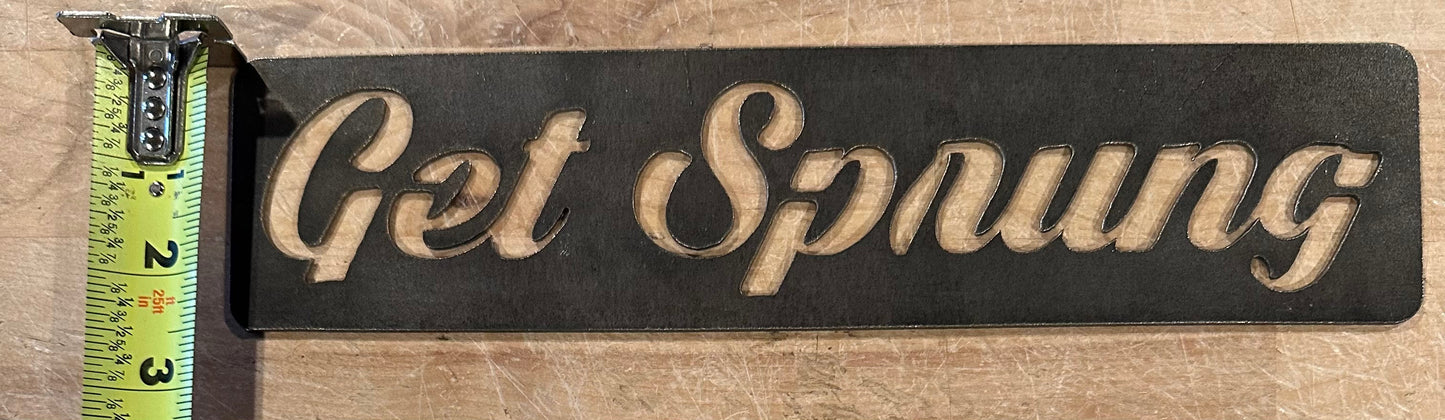 The GET SPRUNG STEEL sign cut out. The AR-TT