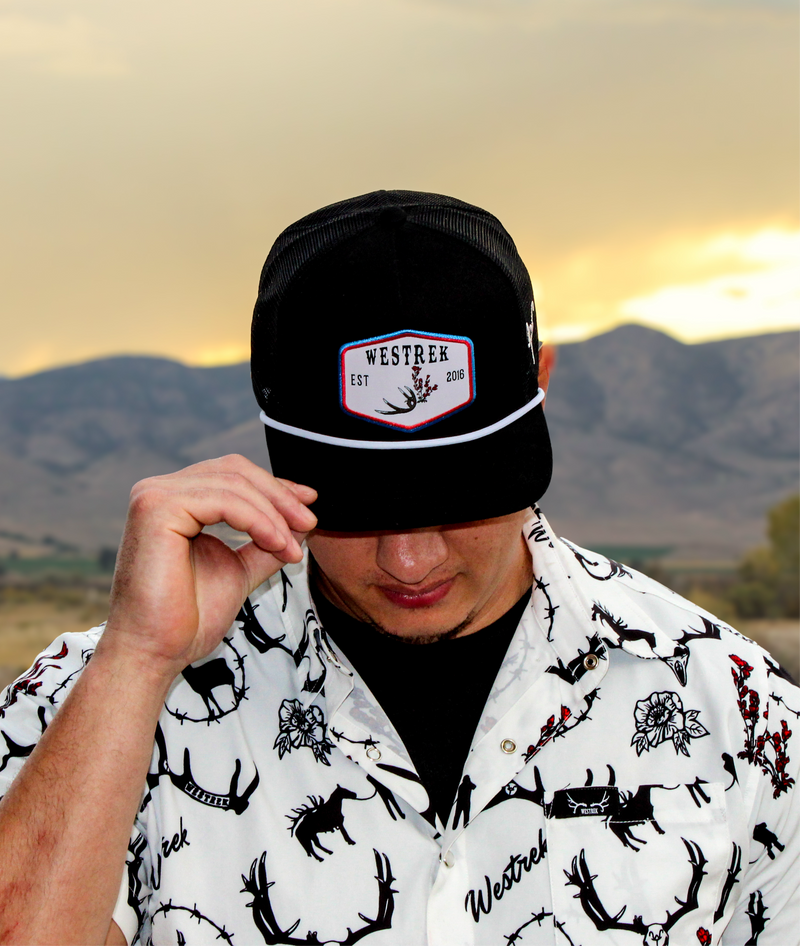 Load image into Gallery viewer, Black “Indian Paintbrush with Deer Antler” Trucker Hat – Western Hunting Hat | Westrek
