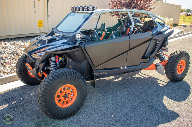 Load image into Gallery viewer, 2022 Polaris RZR Pro R Launch Featuring Rokblokz Fender Kit in Black - front 3/4 view
