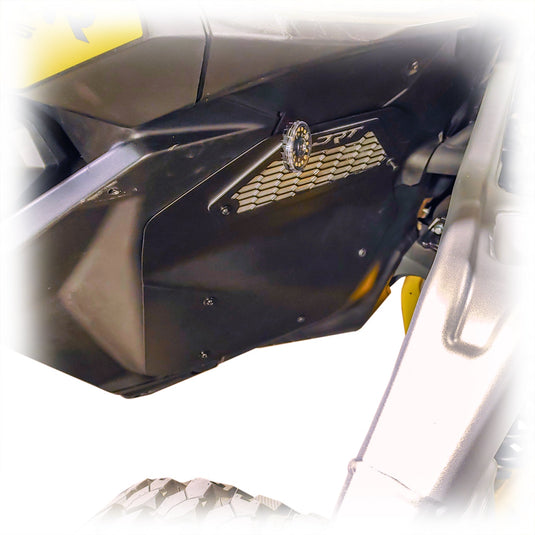 Close-up of a front aluminum rock guard installed on a Maverick R.