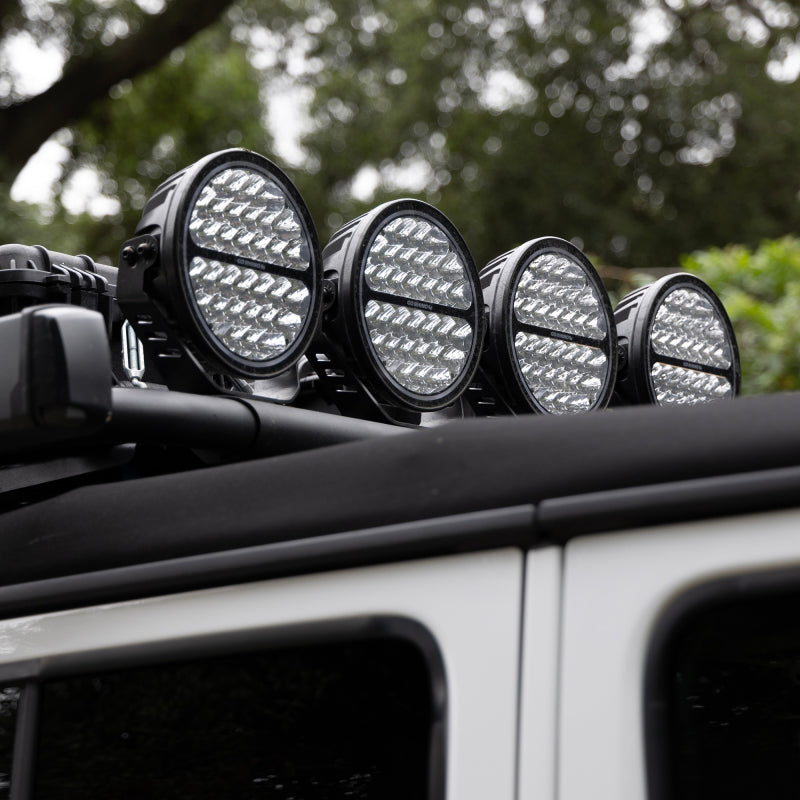 Load image into Gallery viewer, Go Rhino Xplor Blackout Series Round Single LED Spot Light Kit w/DRL (Surface Mount) 9in. - Blk
