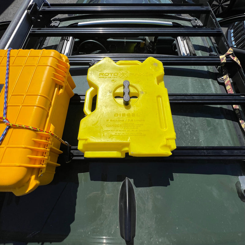 Load image into Gallery viewer, Billet aluminum Rotopax mount adapter for extrusion roof rack cross bars.
