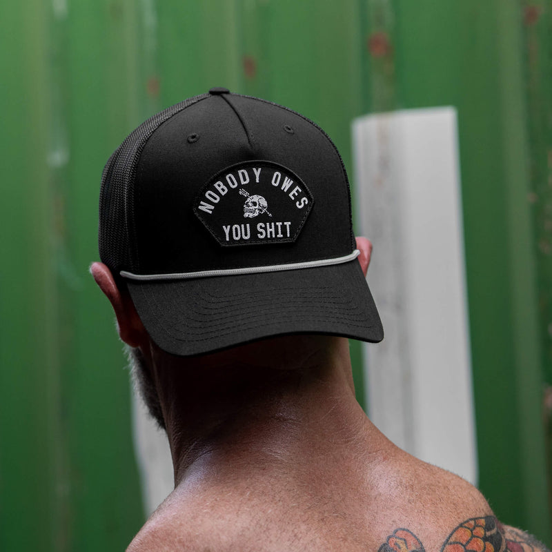 Load image into Gallery viewer, Nobody Owes You Shit Skull Arched Patch Rope Snapback

