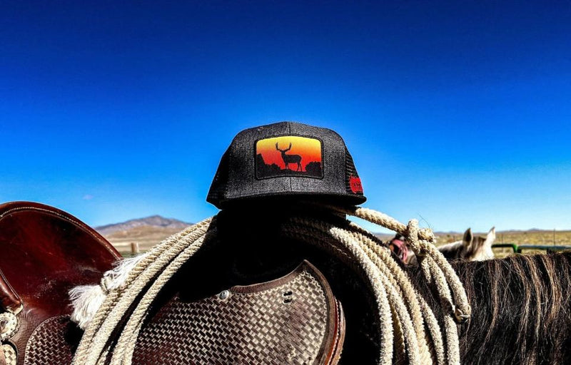 Load image into Gallery viewer, Desert Sunset Muley Edition Trucker Hat – Hand-Drawn Sunset Buck Logo | Western Hunting Hat | Westrek
