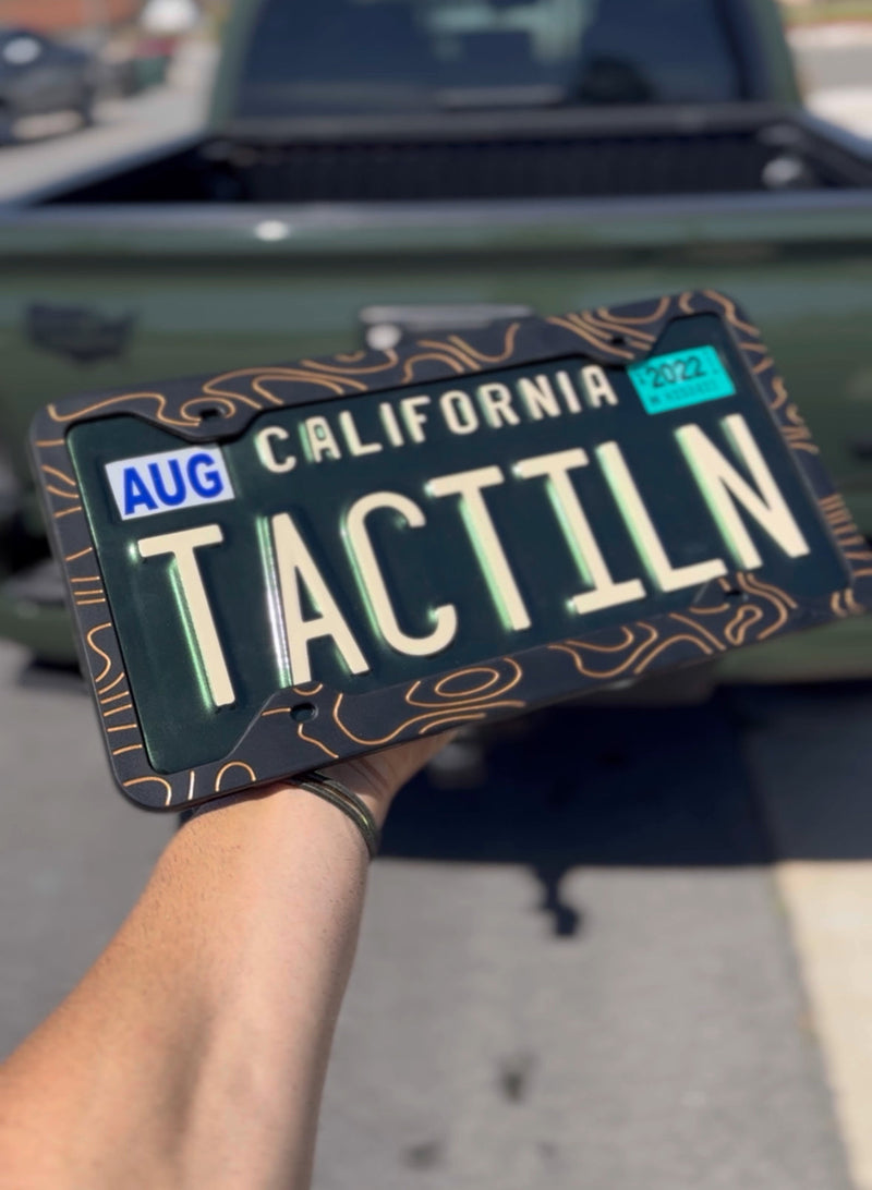 Load image into Gallery viewer, Two-Tone Silicone Topographic License Plate Frame - Anti-Rattle, Anti-Scratch Plate Wrap

