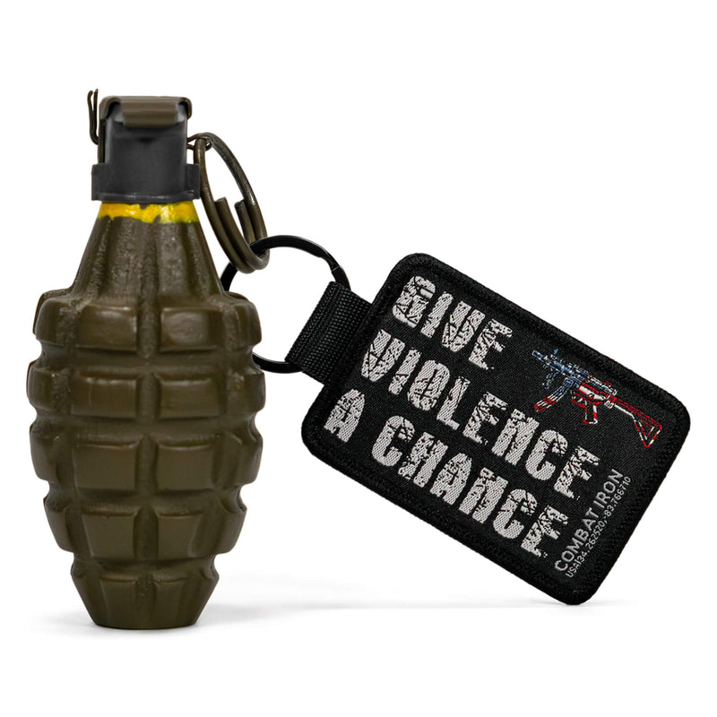 Load image into Gallery viewer, Give Violence A Chance Flight Tag Keychain
