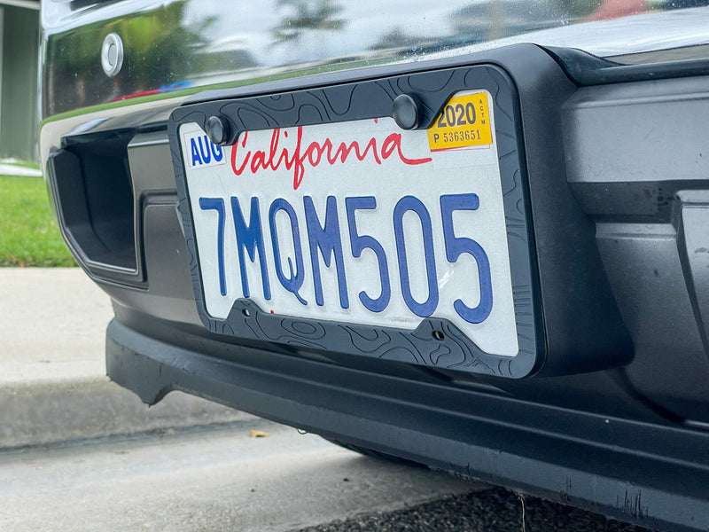 Load image into Gallery viewer, SILICONE TOPOGRAPHY LICENSE PLATE FRAME - ANTI-RATTLE, ANTI-SCRATCH
