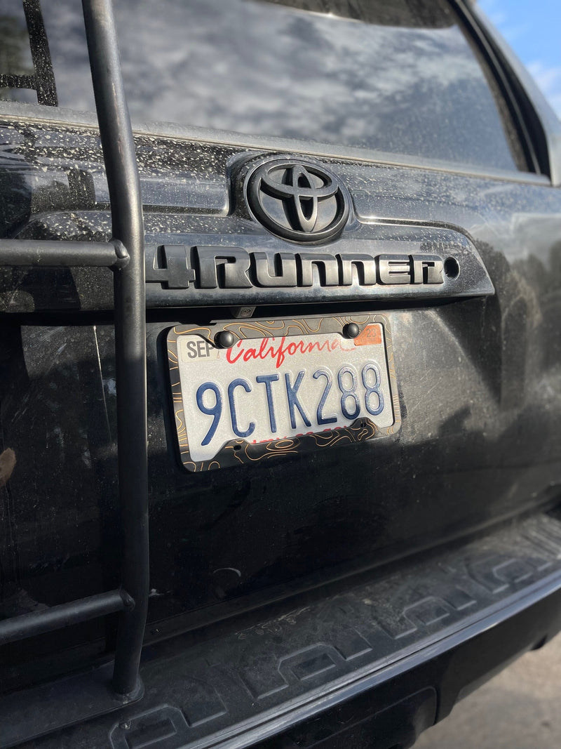 Load image into Gallery viewer, Two-Tone Silicone Topographic License Plate Frame - Anti-Rattle, Anti-Scratch Plate Wrap
