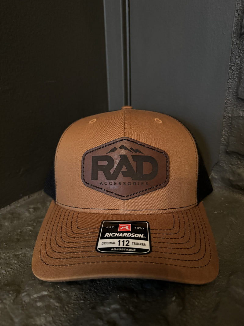 Load image into Gallery viewer, Rad Accessories Snap Back Leather Patch Trucker Hat Caramel &amp; Black
