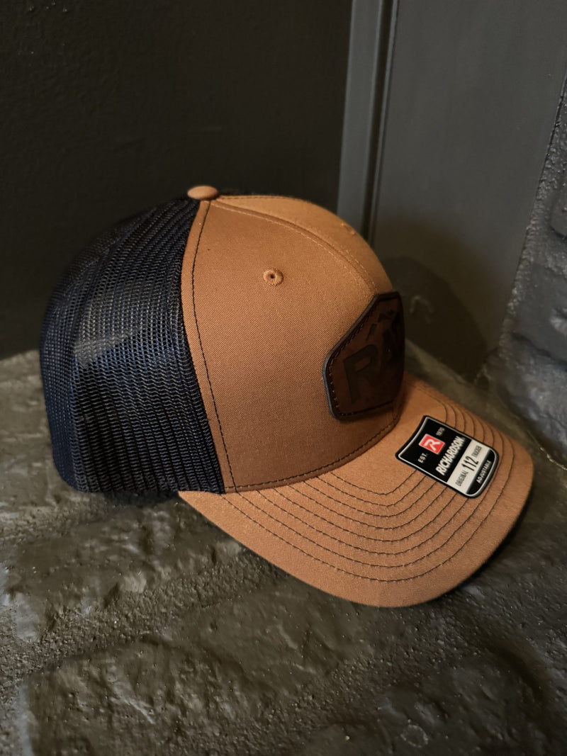 Load image into Gallery viewer, Rad Accessories Snap Back Leather Patch Trucker Hat Caramel &amp; Black
