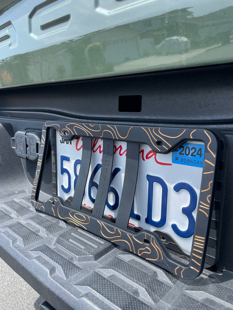 Load image into Gallery viewer, Two-Tone Silicone Topographic License Plate Frame - Anti-Rattle, Anti-Scratch Plate Wrap
