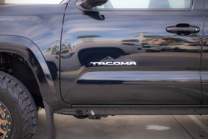 Load image into Gallery viewer, Toyota Tacoma Badge Mountain Range Magnet (2016+)
