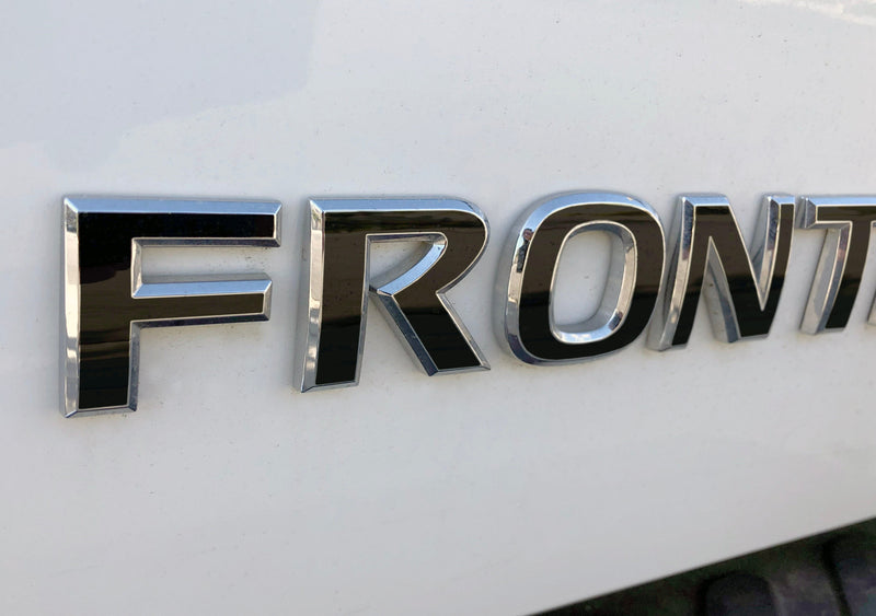 Load image into Gallery viewer, Premium Cast Vinyl Decal Letter Inlays for 2005-2021 Frontier Tailgate Emblems
