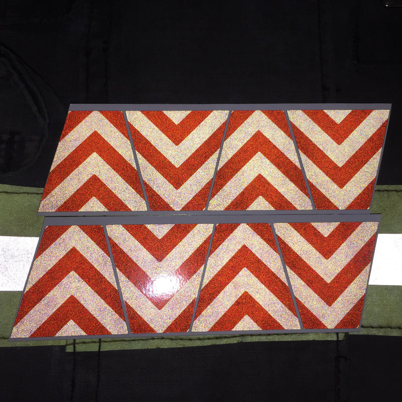 Load image into Gallery viewer, BLACKED OUT BLACK AND ORANGE CHEVRON REFLECTIVE HELMET (TET) TETRAHEDRON 8 PACK
