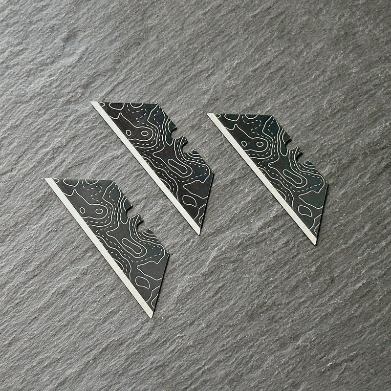 Load image into Gallery viewer, Stinger Laser Engraved Utility Blades, Utility Tool Replacements - Black Topographic Style (Trapezoid 3 pcs - Black)
