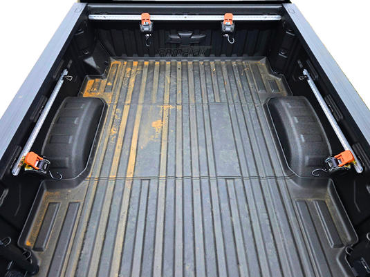 Truck bed tie down system