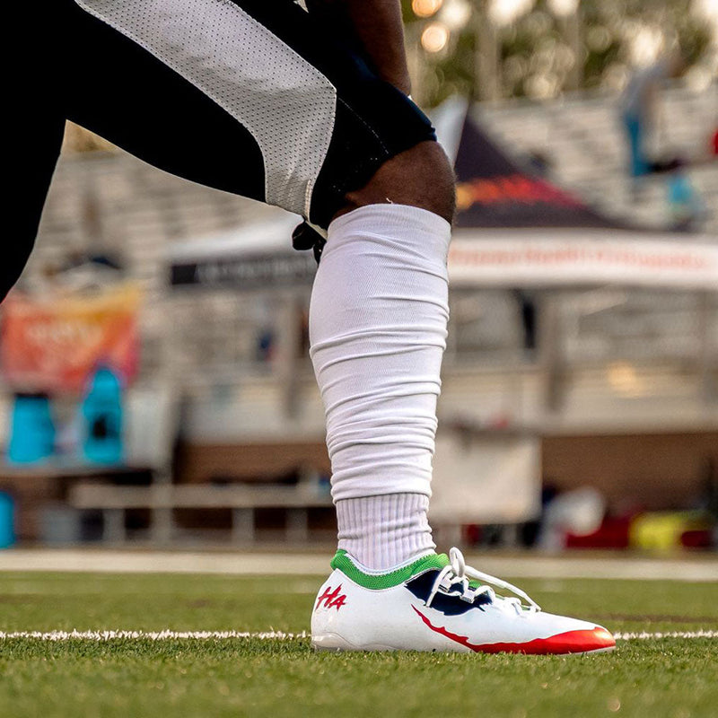 Load image into Gallery viewer, The Officially Licensed Joker Youth Football Cleats - Velocity 2.0 by Phenom Elite
