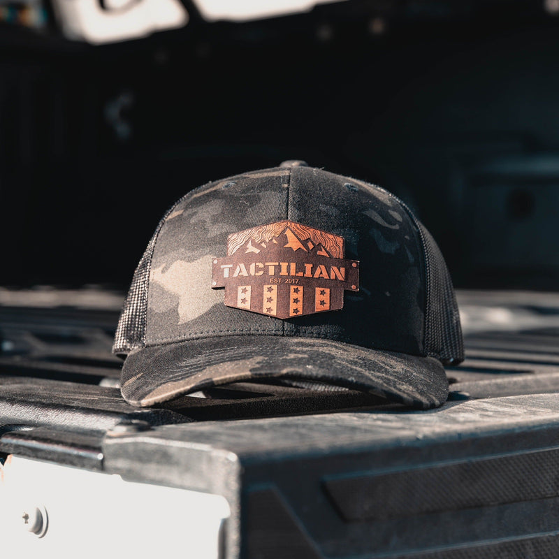 Load image into Gallery viewer, Tactilian Black Multicam Leather Patch Snap Back Hat
