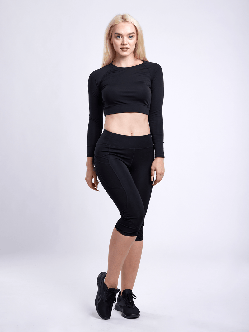 Load image into Gallery viewer, JupiterGear Mid-Rise Capri Fitness Leggings with Side Pockets
