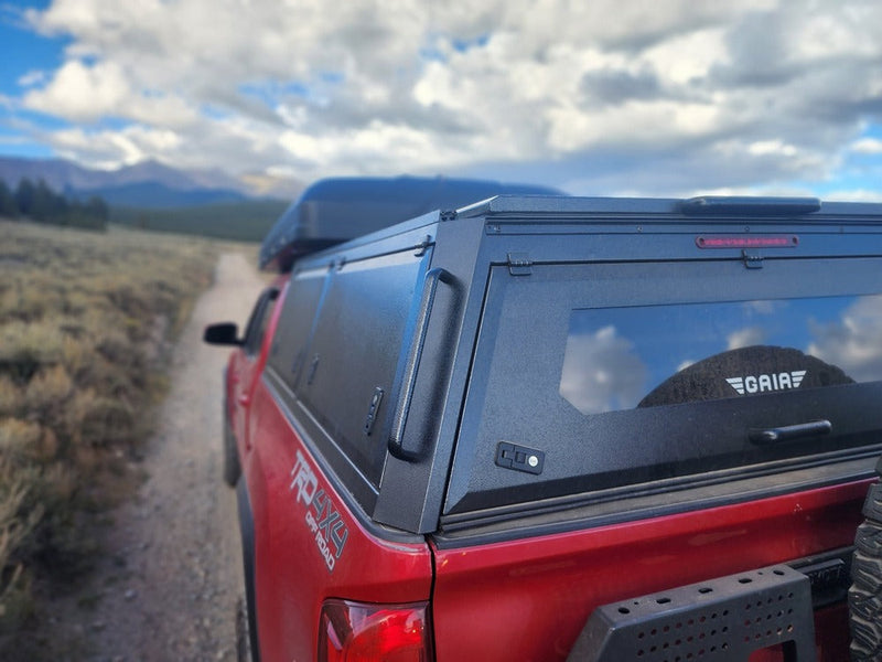 Load image into Gallery viewer, GAIA Campers Chevy Colorado Longbed Truck Cap - 2015-2022 (Downpayment)
