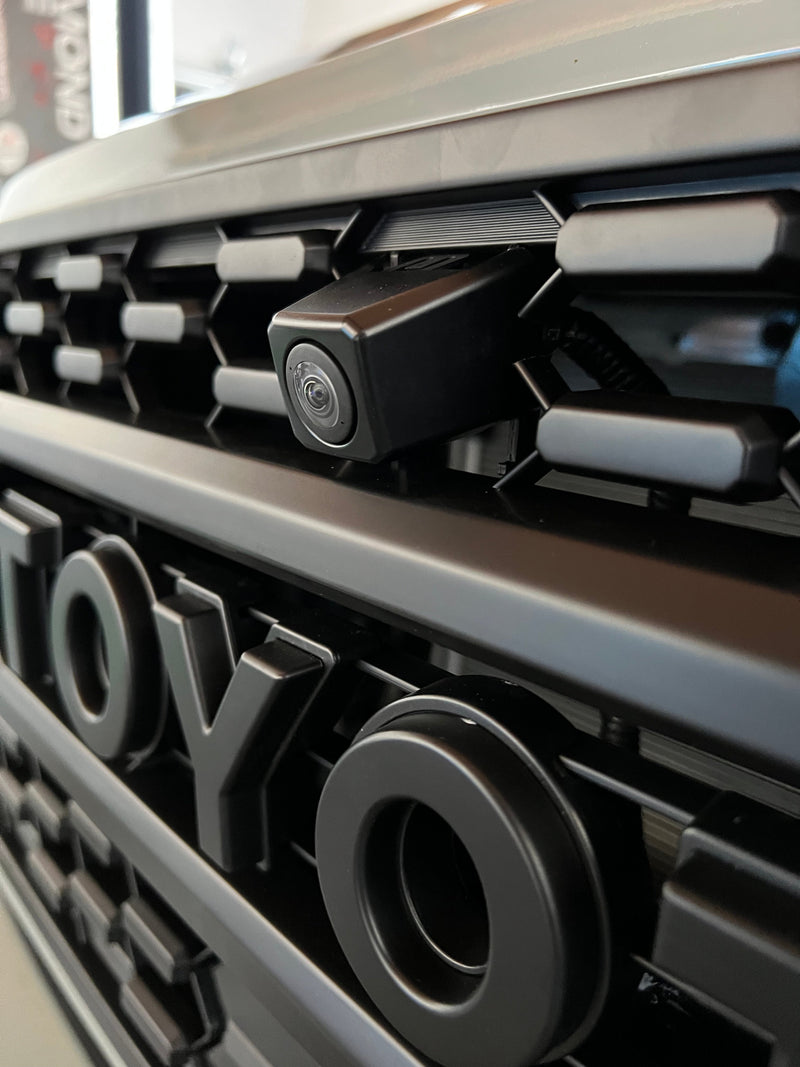 Load image into Gallery viewer, Front OEM Camera Mounting Bracket for Aftermarket TRD Pro Grille 2020 - 2023 Toyota Tacoma.

