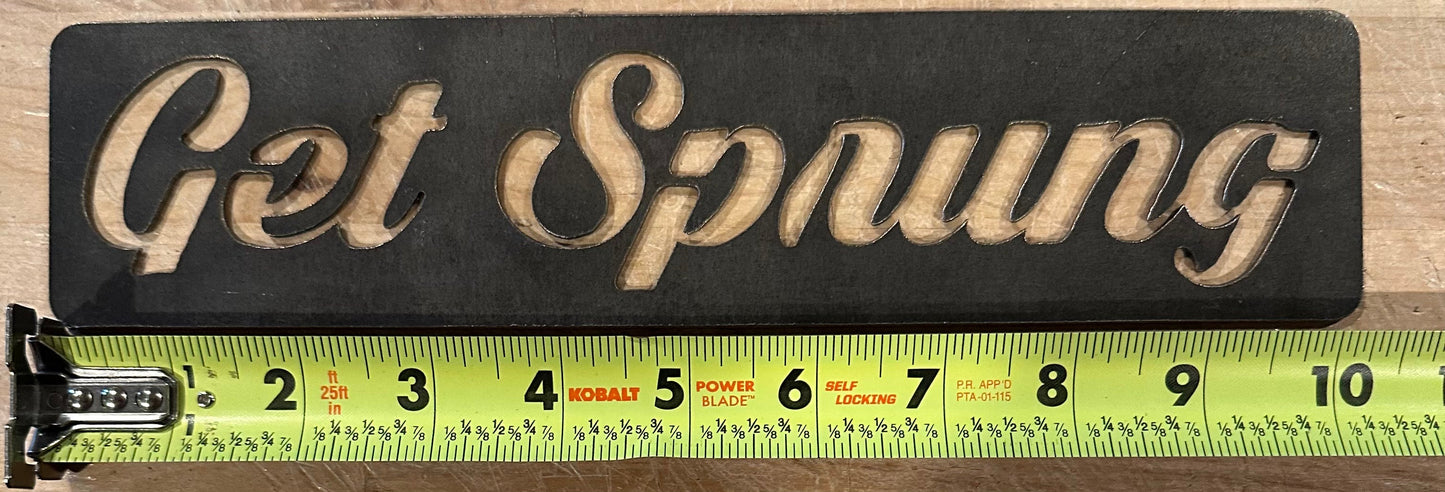 The GET SPRUNG STEEL sign cut out. The AR-TT