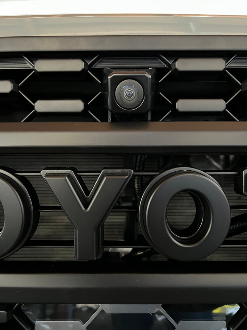 Load image into Gallery viewer, Front OEM Camera Mounting Bracket for Aftermarket TRD Pro Grille 2020 - 2023 Toyota Tacoma.
