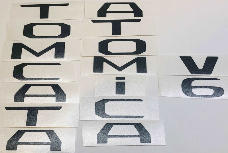 Load image into Gallery viewer, Premium Cast Matte Black Vinyl Decal Letter Inlays for 2016-2023 Tacoma Emblems
