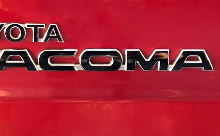 Load image into Gallery viewer, Premium Cast Vinyl Decal Letter Inlays for 2005-2015 Tacoma Door and Tailgate Emblems
