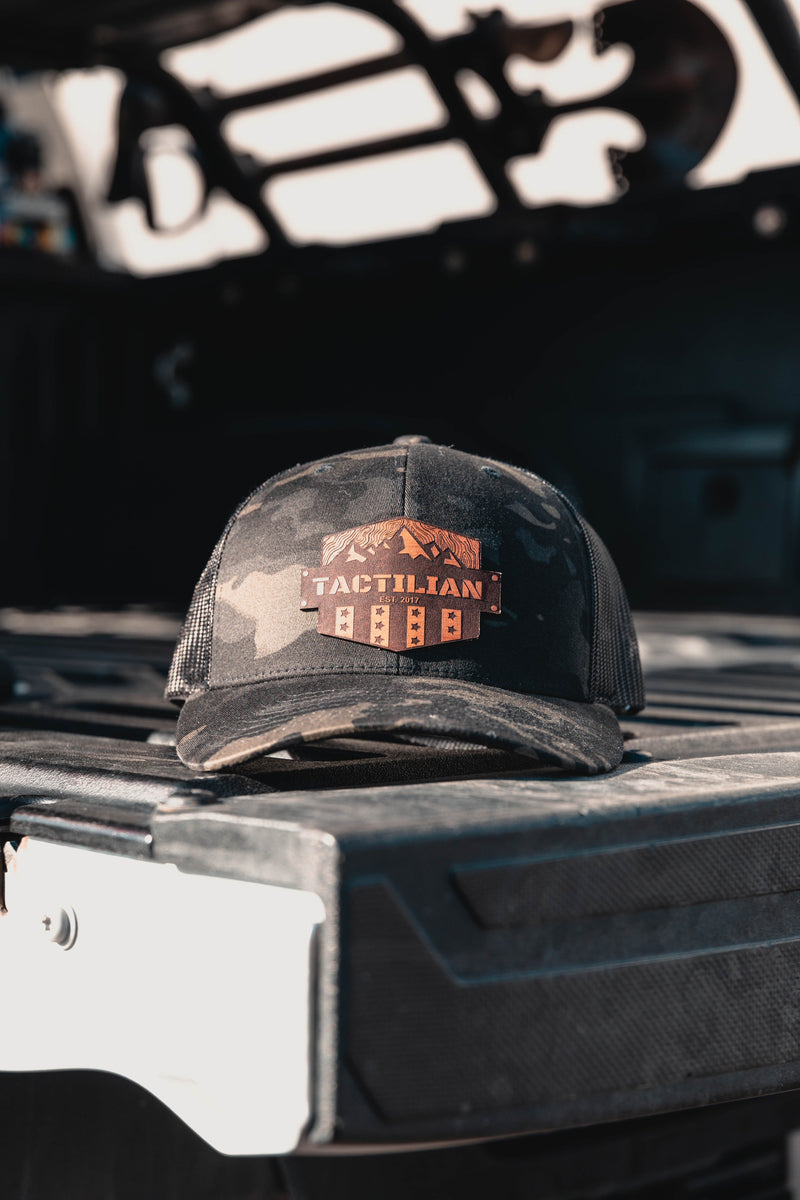 Load image into Gallery viewer, Tactilian Black Multicam Leather Patch Snap Back Hat
