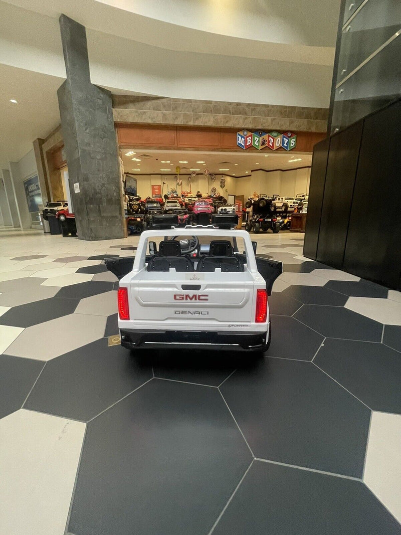 Load image into Gallery viewer, 24V Interactive TV GMC Ride On Electric Toy 4x4 with Leather Seating and Advanced Rubber EVA Tires - Remote Control
