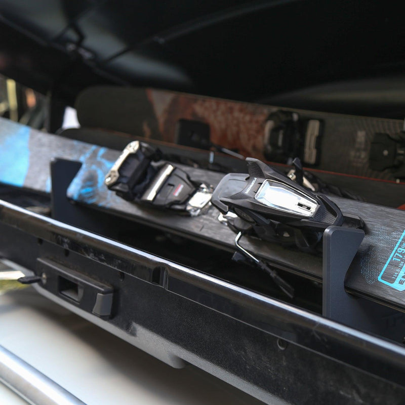 Load image into Gallery viewer, TRAPSKI LowPro 3 M Ski and Snowboard Rack Insert for Rooftop Cargo Box | High Quality Marine Grade HDPE Plastic | UV Protected | Premium Strap Included | 3 Year Warranty | Made in the USA
